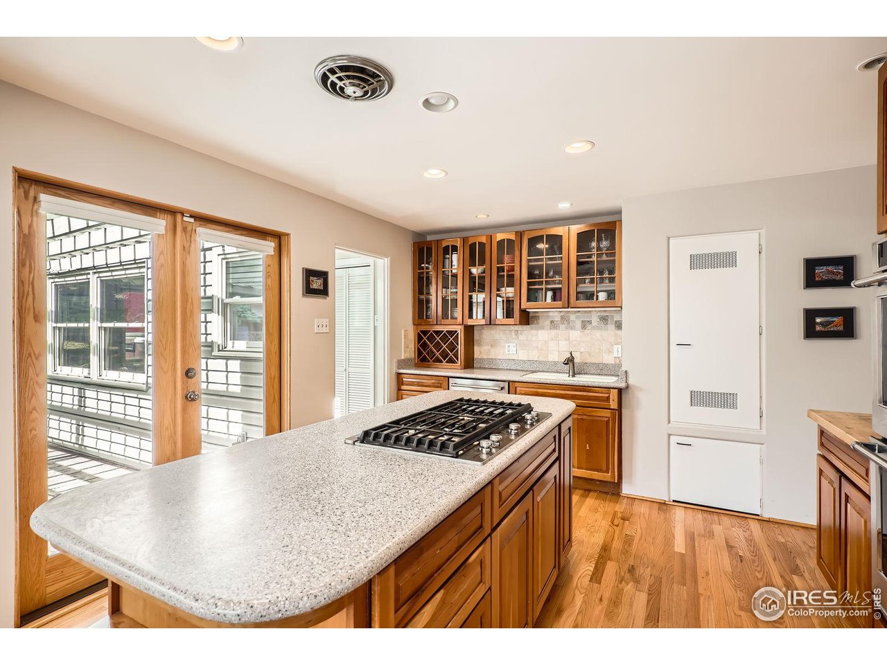 419 22nd Street Boulder, CO 80302 - Photo 10 of 38 a view of kitchen and utility room with wooden floor