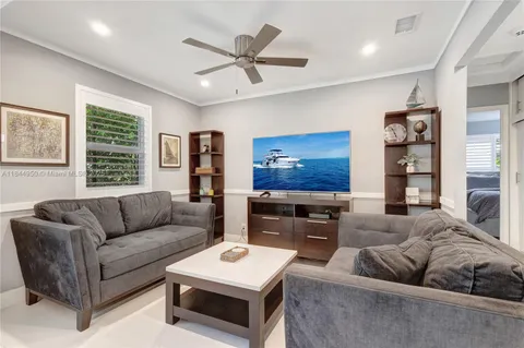 a spacious bedroom with a large bed and a window