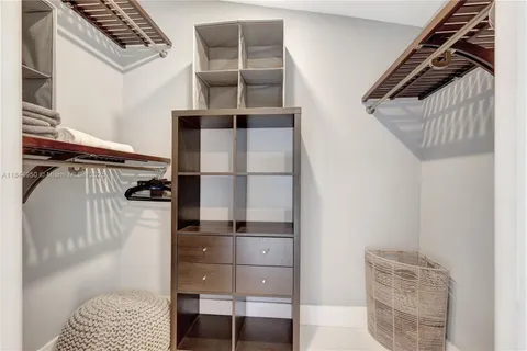 a bathroom with a toilet sink vanity and mirror