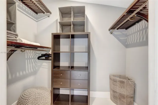 a bathroom with a toilet sink vanity and mirror
