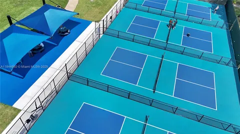a aerial view of a house with yard