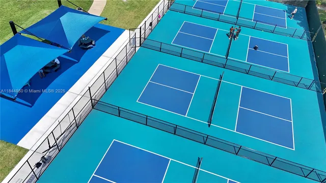 a aerial view of a house with yard