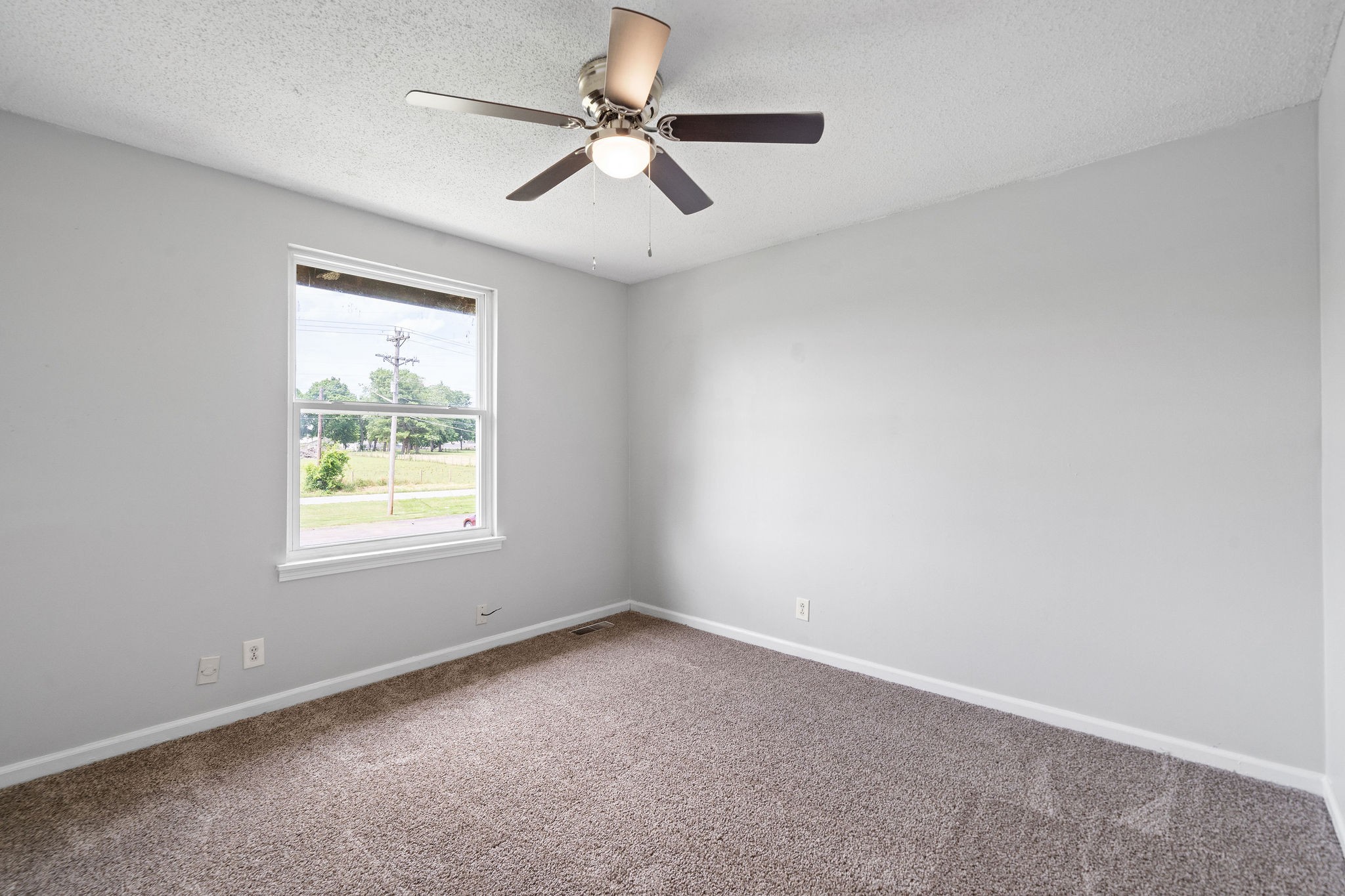 1231 State Line Road, Unit 46 Oak Grove, KY 42262 - Photo 11 of 12 an empty room with a window and a fan