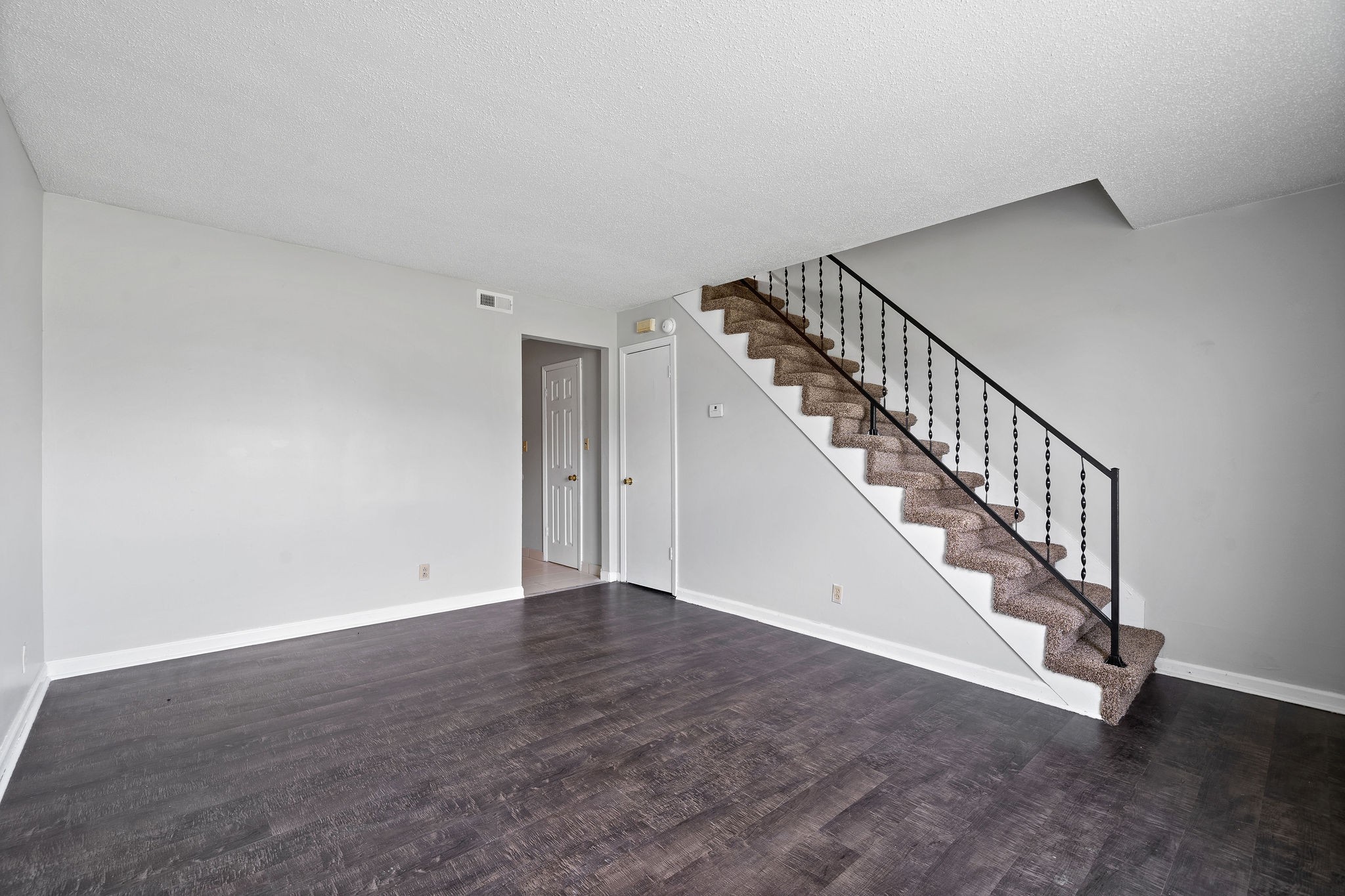 1231 State Line Road, Unit 46 Oak Grove, KY 42262 - Photo 4 of 12 a view of an empty room with stairs