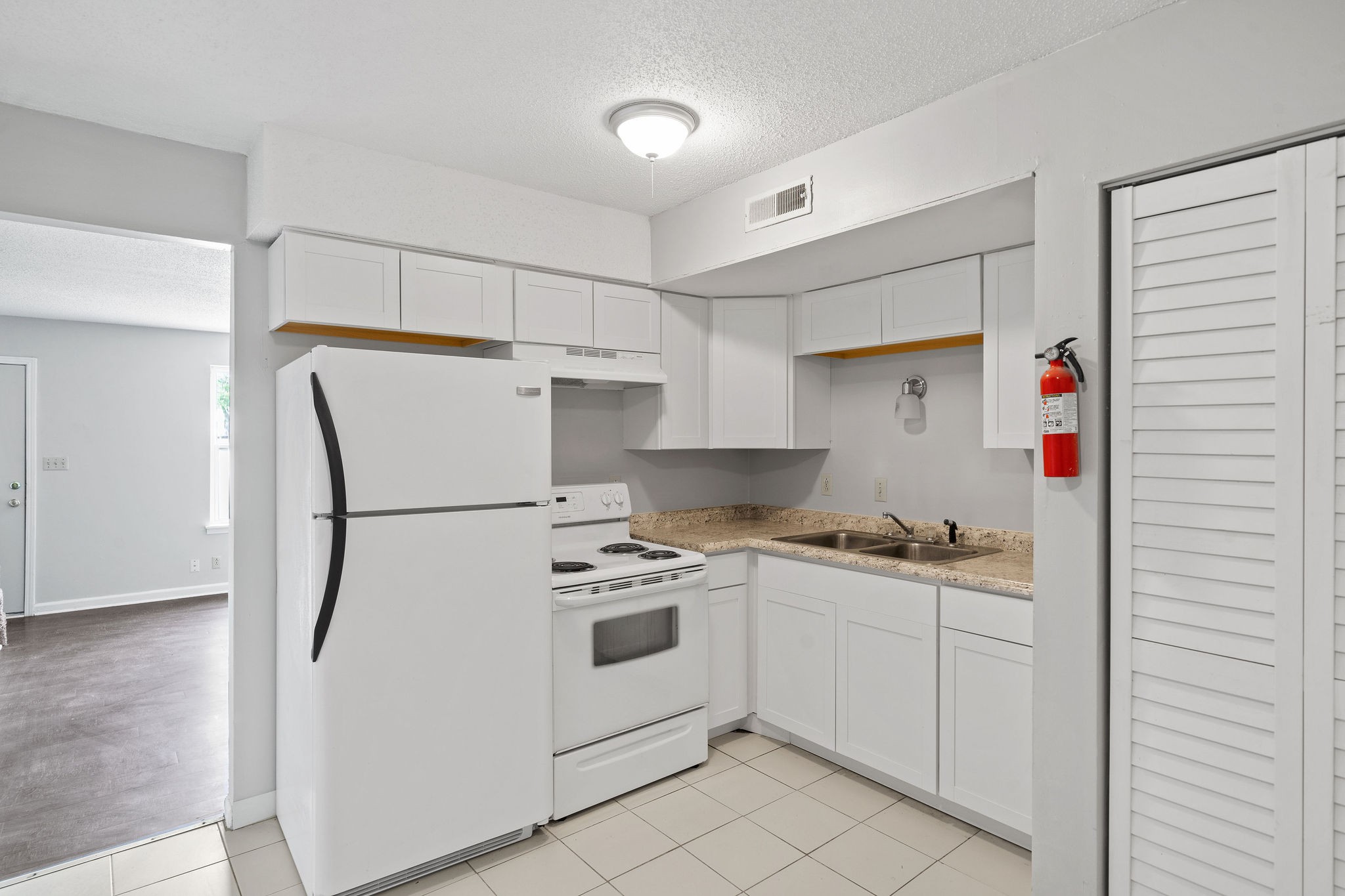 1231 State Line Road, Unit 46 Oak Grove, KY 42262 - Photo 6 of 12 a kitchen with a stove a refrigerator and a sink