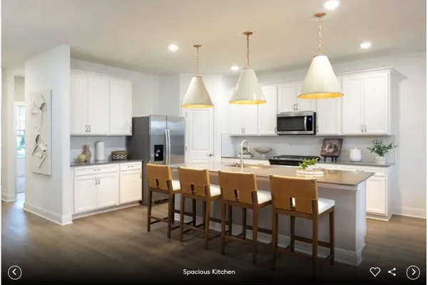 a kitchen with kitchen island granite countertop a sink a center island and cabinets