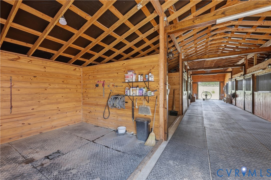 25181 West Soap Stone Road Jetersville, VA 23083 - Photo 40 of 54 Barn interior featuring wood plank walls and expos