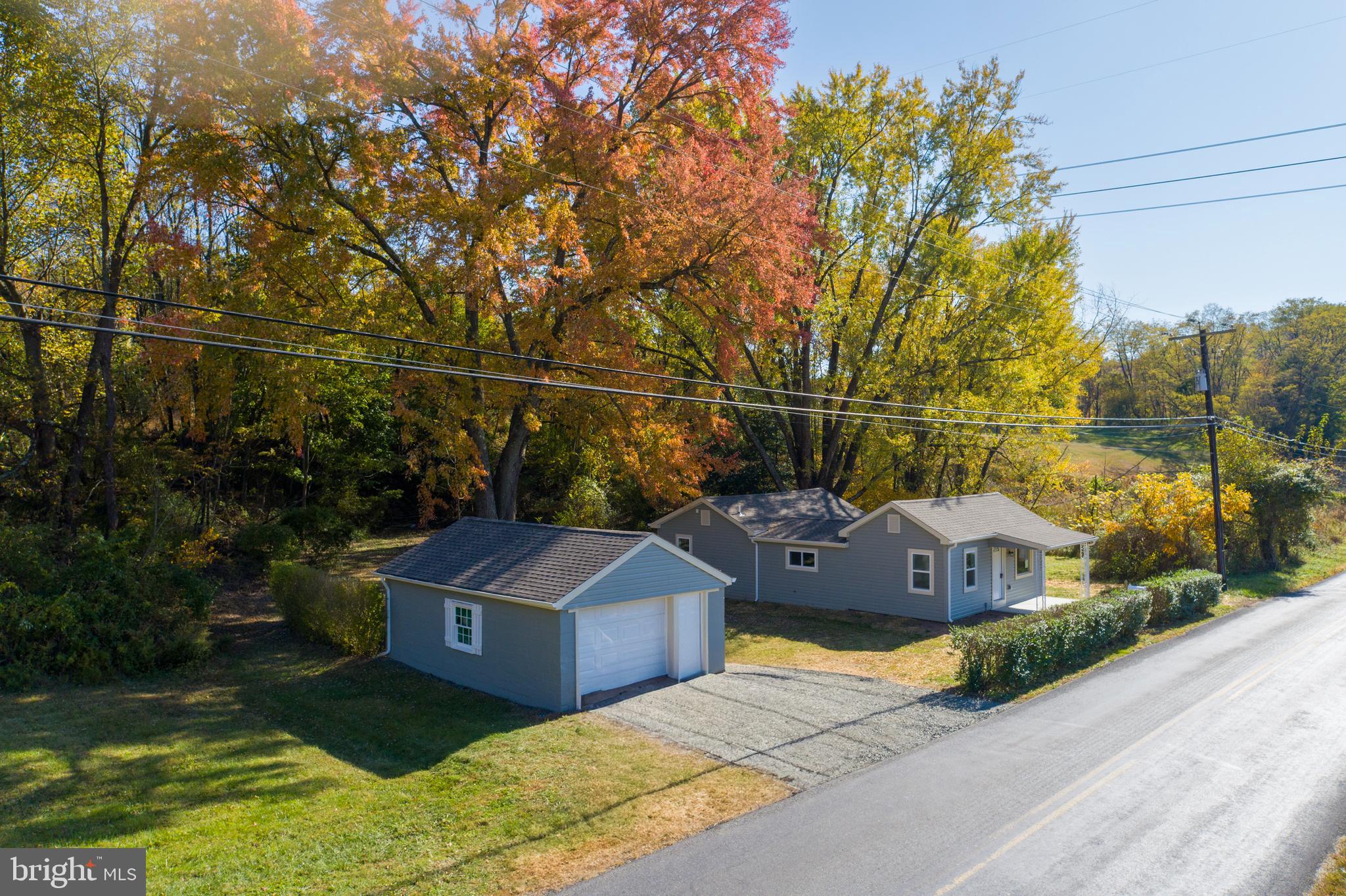 201 Hill Church Road Bechtelsville, PA 19505 - Photo 16 of 28 a view of a houses with yard and trees in the background