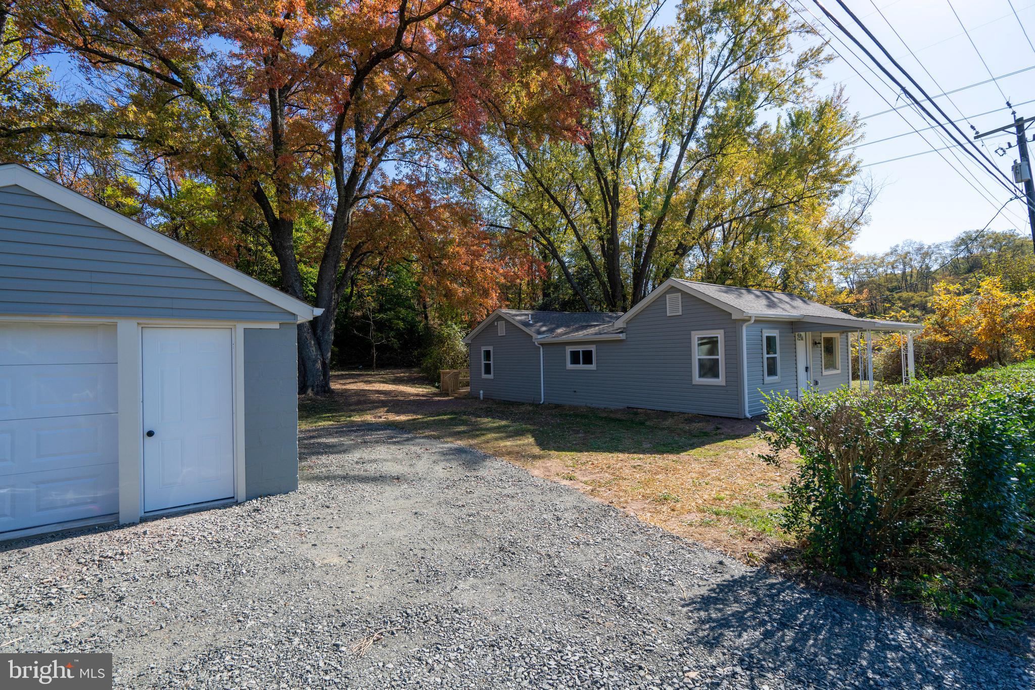201 Hill Church Road Bechtelsville, PA 19505 - Photo 20 of 28 a front view of a house with a yard and garage