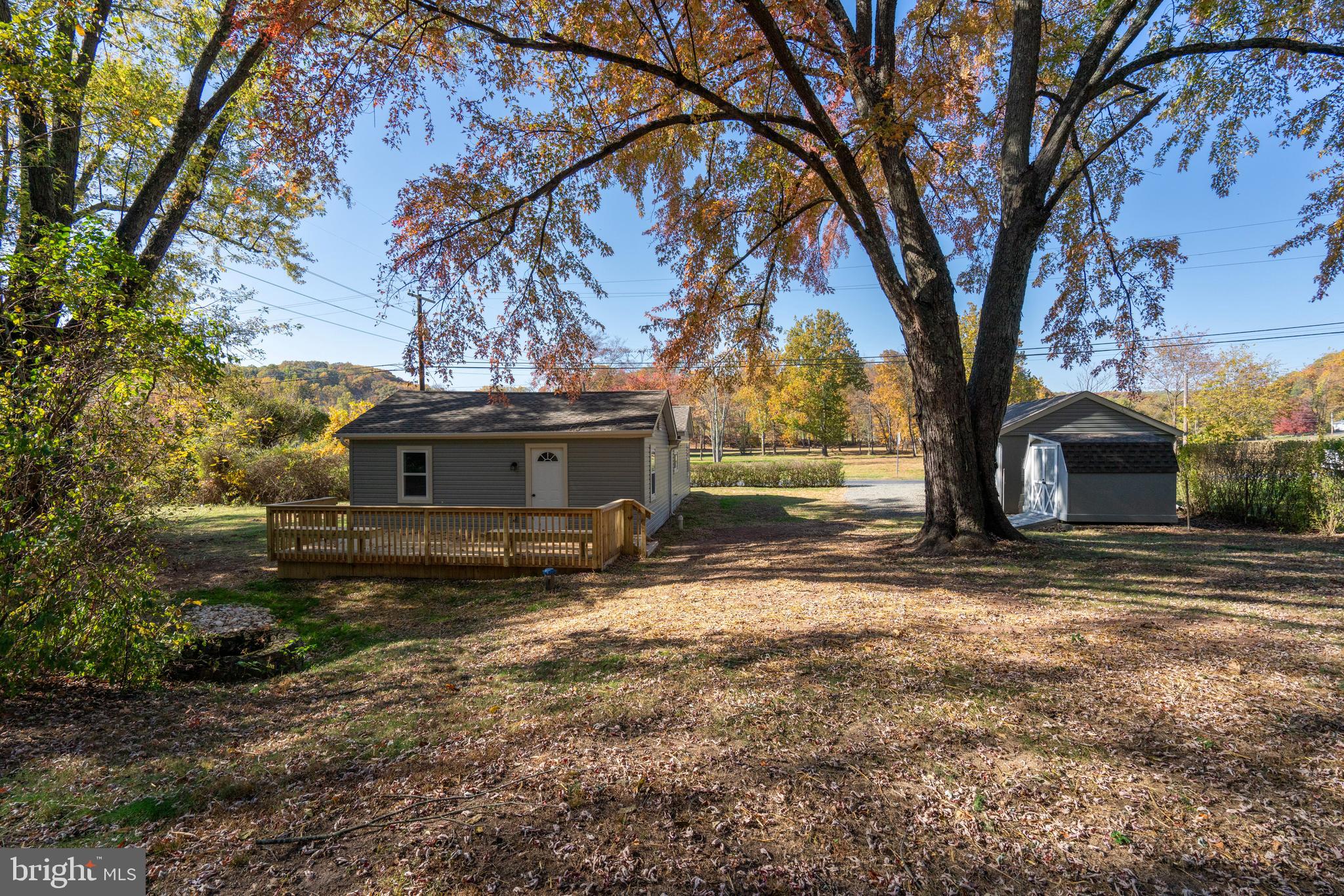 201 Hill Church Road Bechtelsville, PA 19505 - Photo 26 of 28 a view of a yard with a house and a large tree