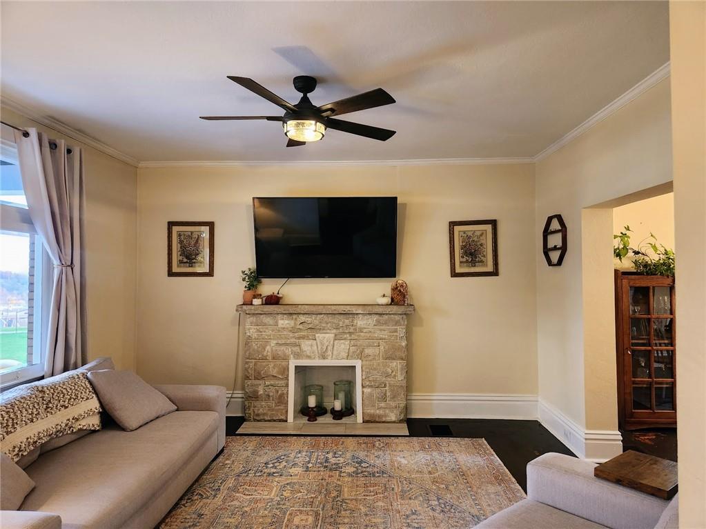 614 3rd Street Butler, PA 16001 - Photo 18 of 43 a living room with furniture a flat screen tv and a fireplace