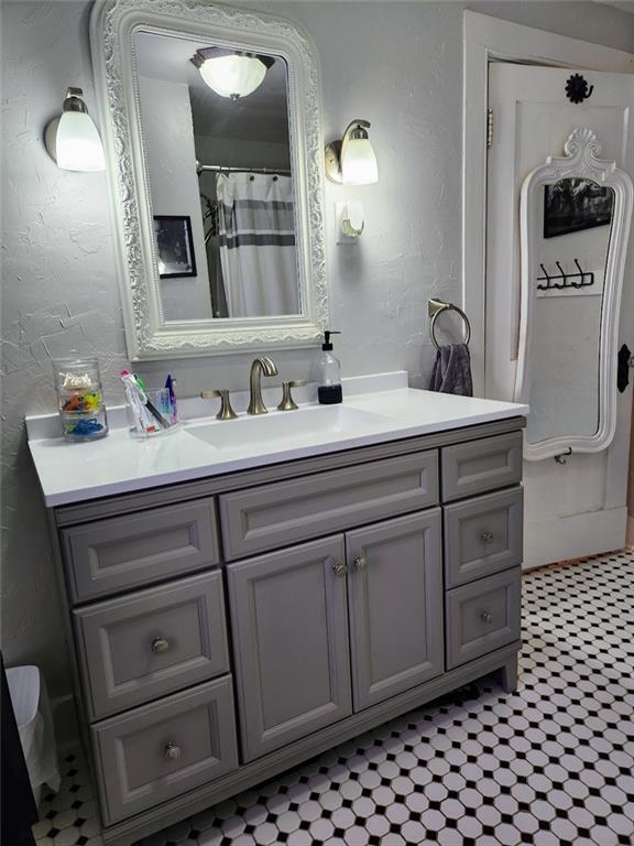 614 3rd Street Butler, PA 16001 - Photo 28 of 43 a bathroom with a sink a vanity and a mirror