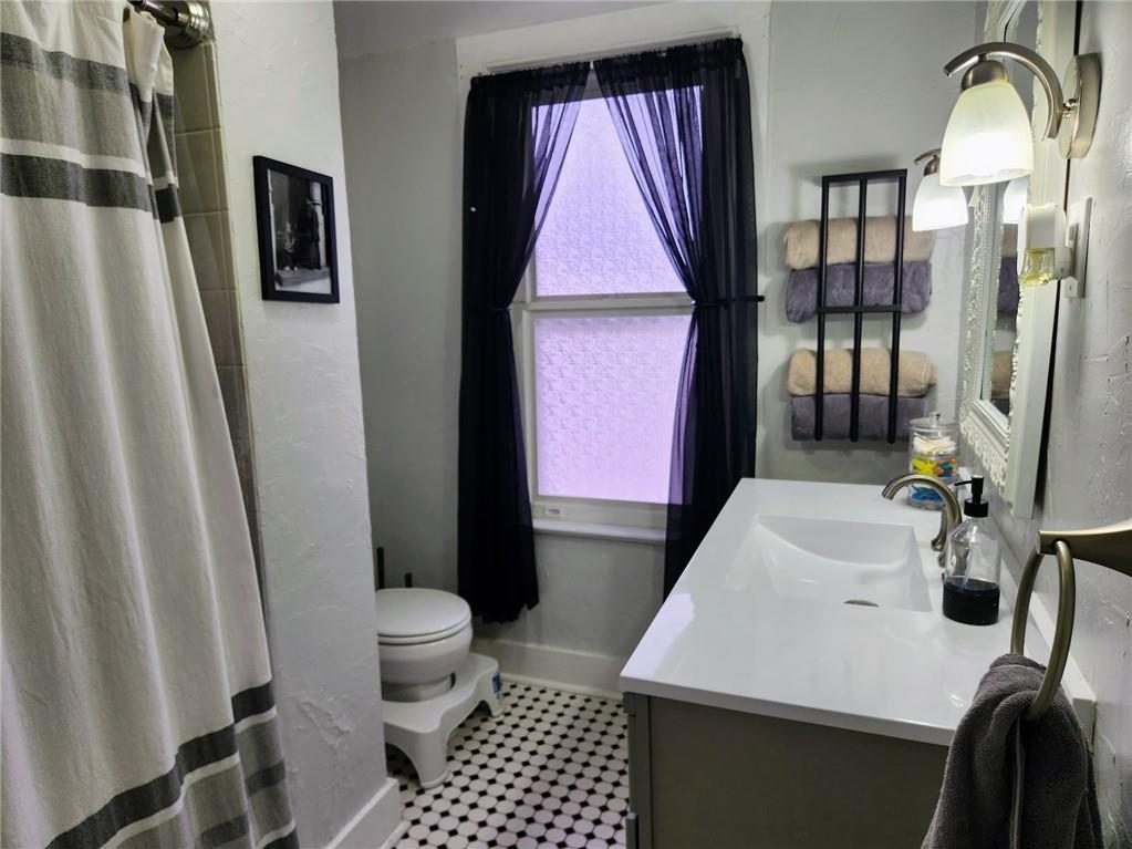 614 3rd Street Butler, PA 16001 - Photo 29 of 43 a bathroom with a sink toilet and shower