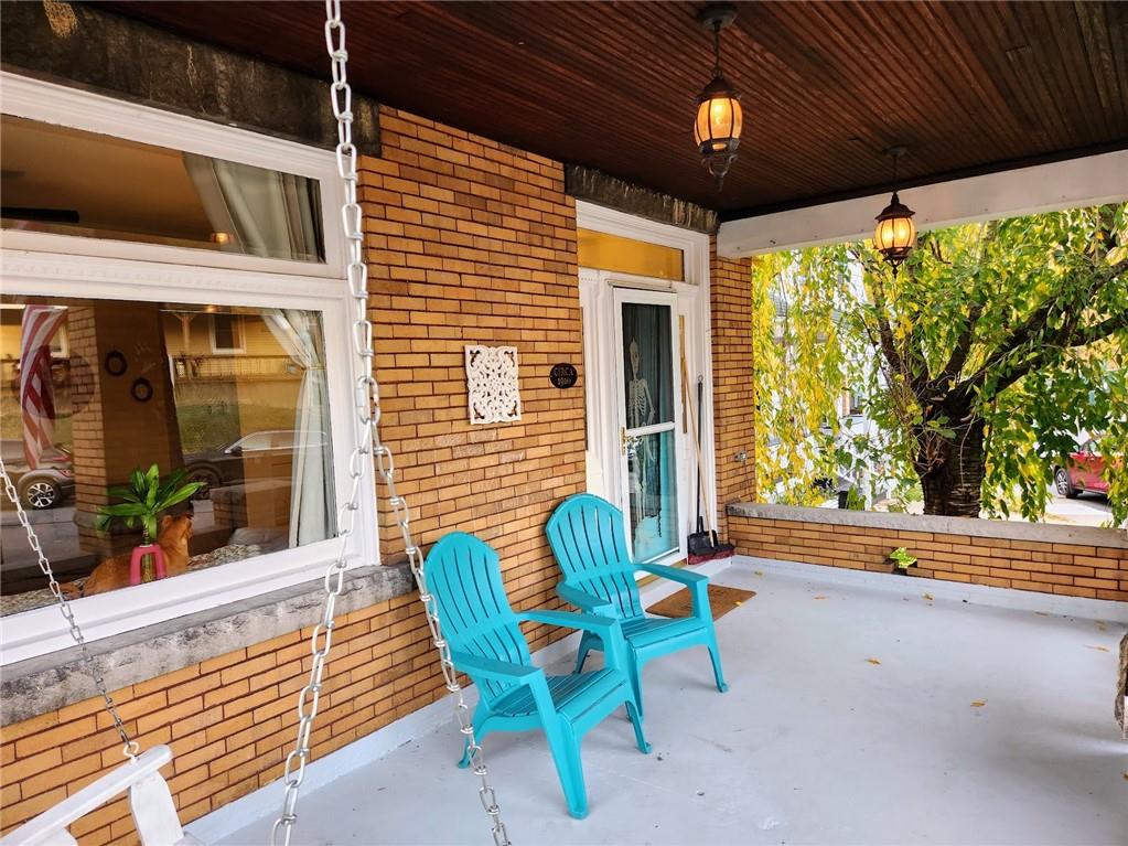 614 3rd Street Butler, PA 16001 - Photo 4 of 43 a view of a porch with a table and chairs