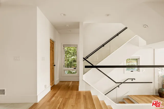 a view of entryway with wooden floor