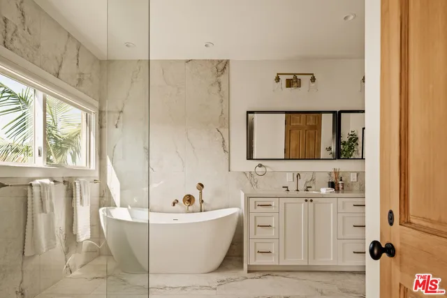 a bathroom with a bathtub and a sink
