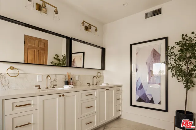 a bathroom with mirror