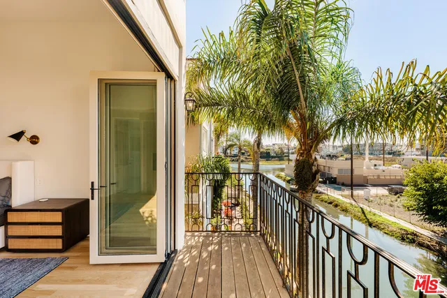 a view of a balcony with potted plants