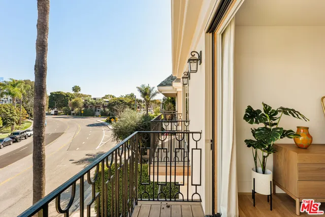 a view of a balcony with the street