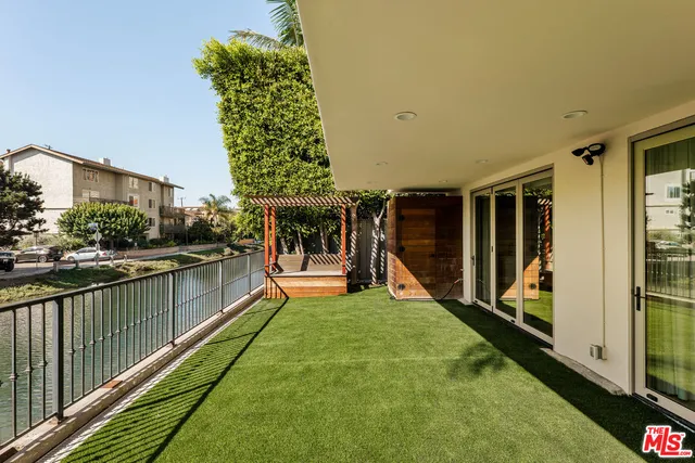 a view of swimming pool with seating space