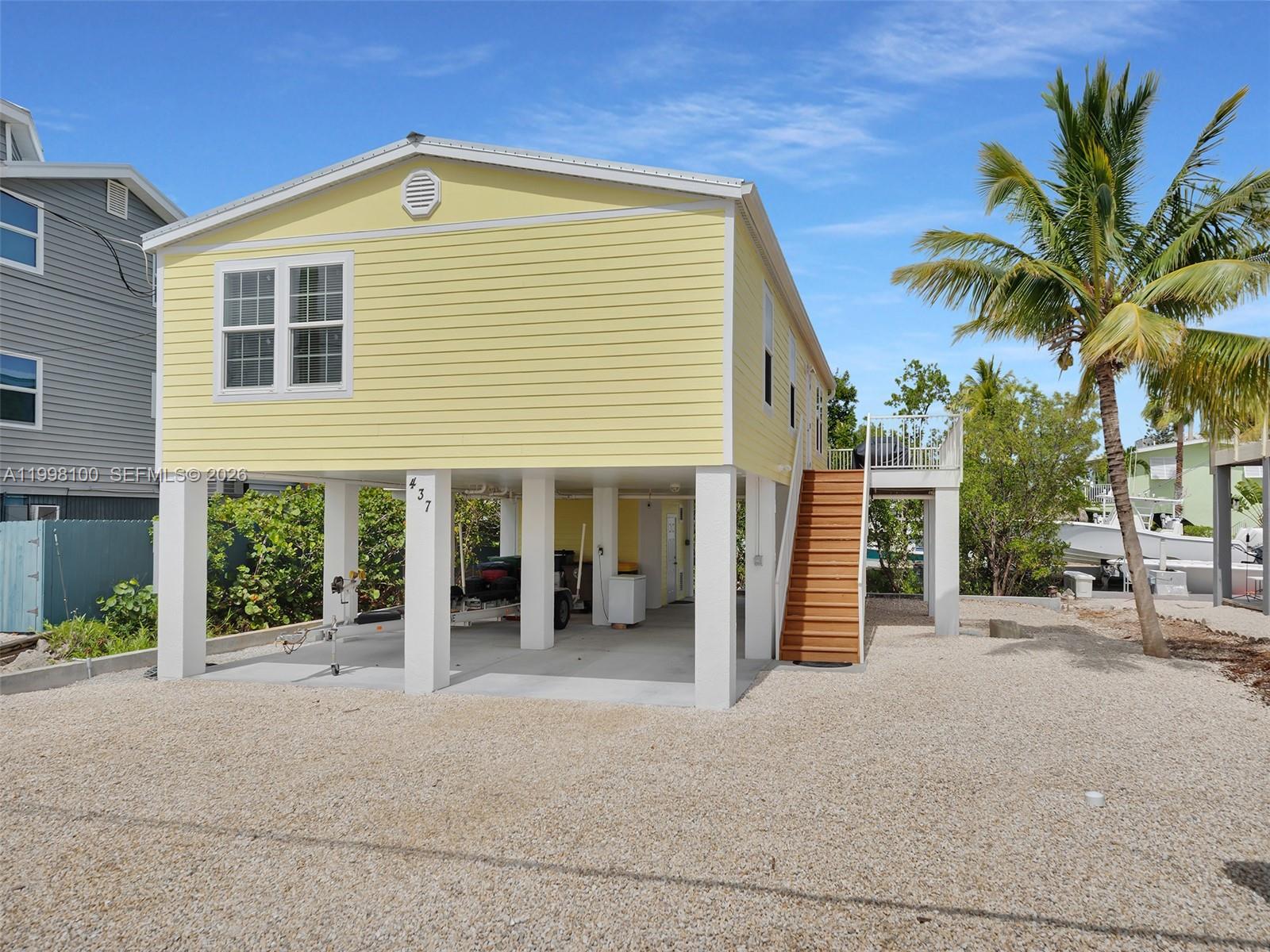 437 Pirates Road Summerland Key, FL 33042 - Photo 38 of 39 a front view of a house with a yard