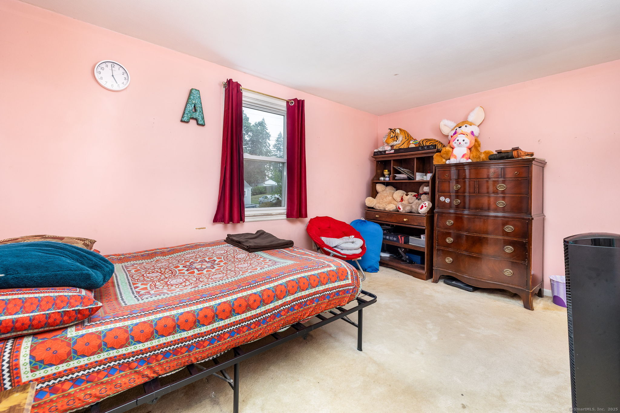 173 Timber Trail Wethersfield, CT 06109 - Photo 15 of 18 a bedroom with a bed and a dresser