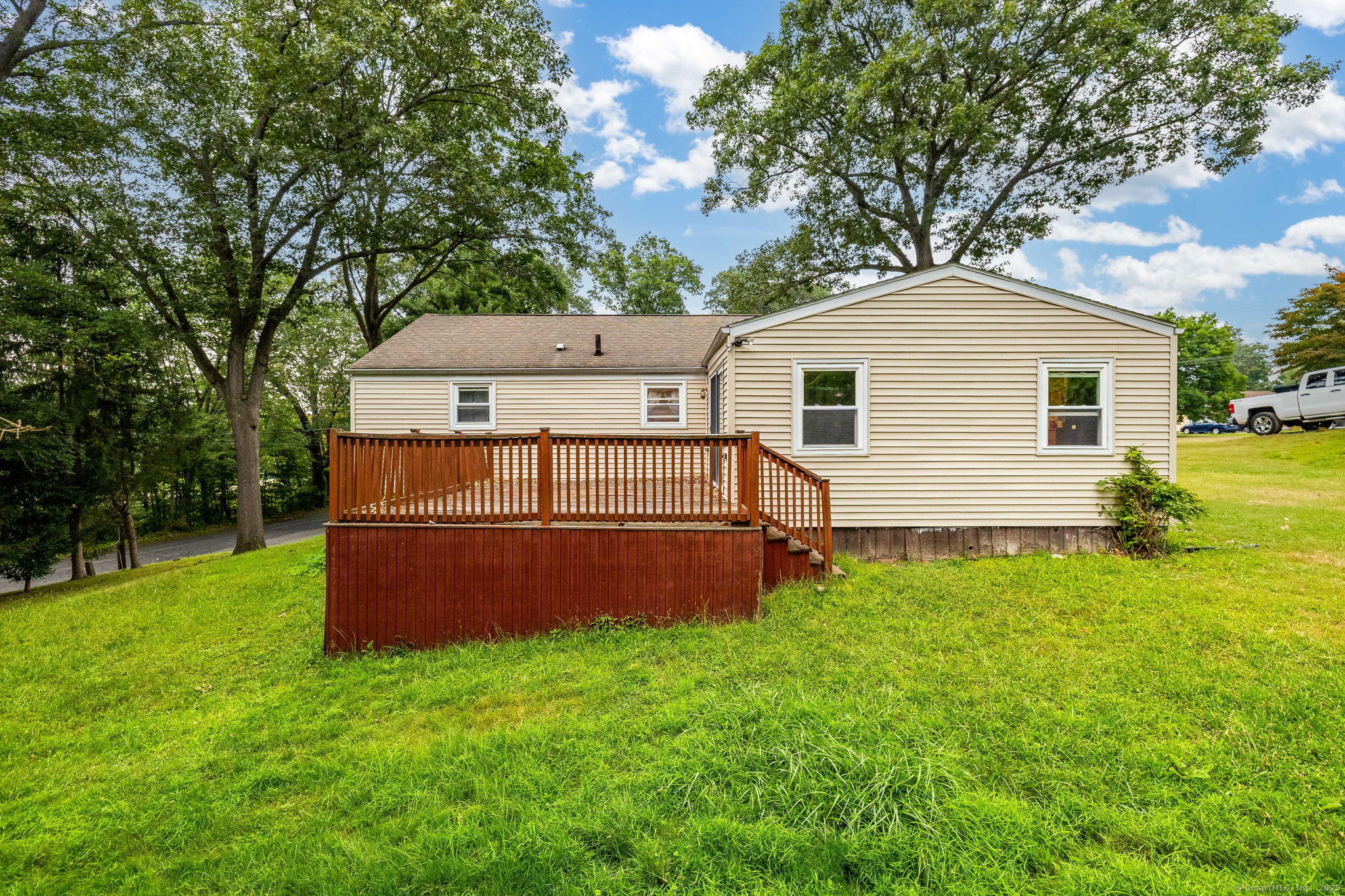 173 Timber Trail Wethersfield, CT 06109 - Photo 2 of 18 a view of backyard of house with green space