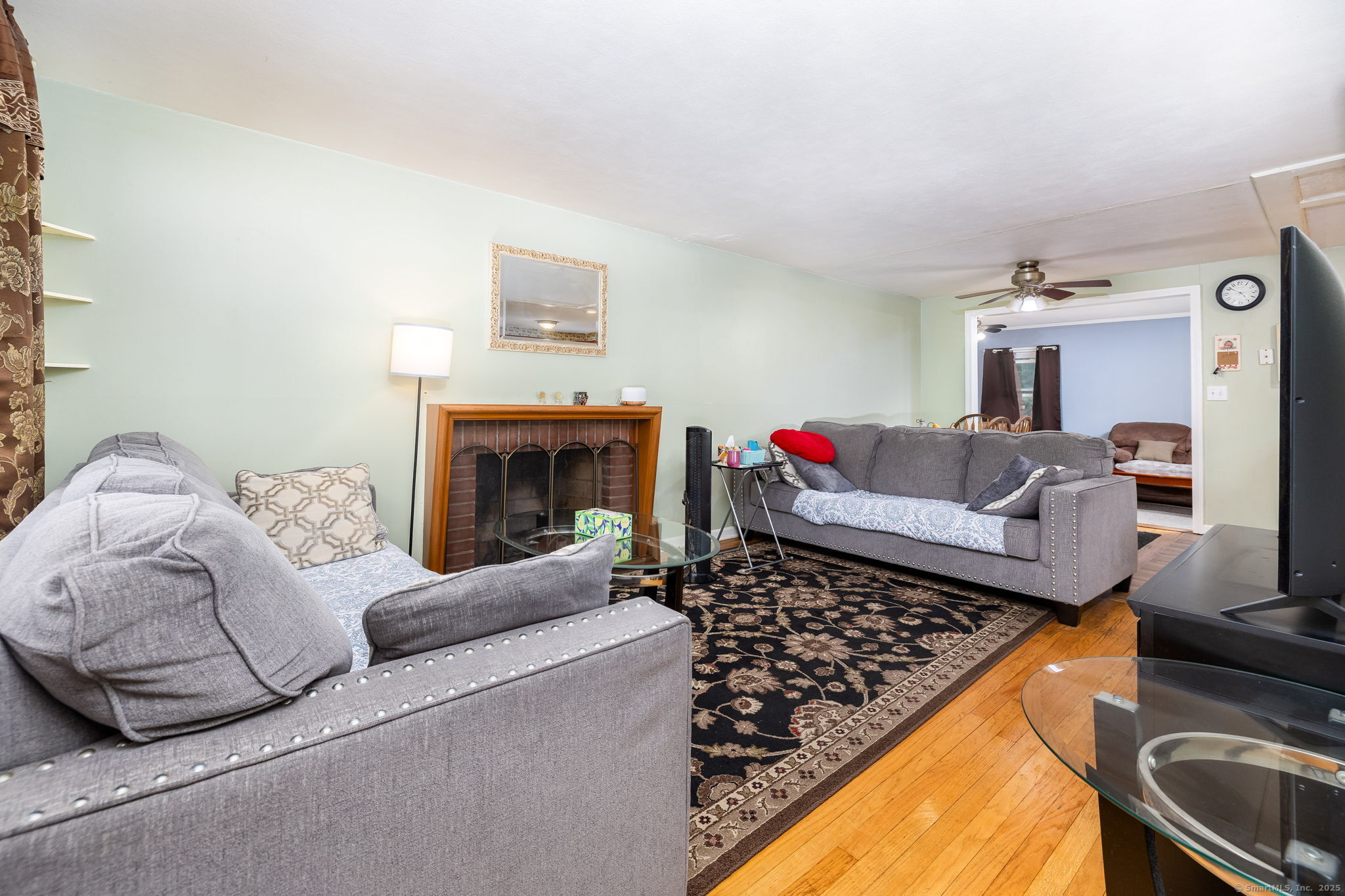 173 Timber Trail Wethersfield, CT 06109 - Photo 4 of 18 a living room with furniture and a fireplace