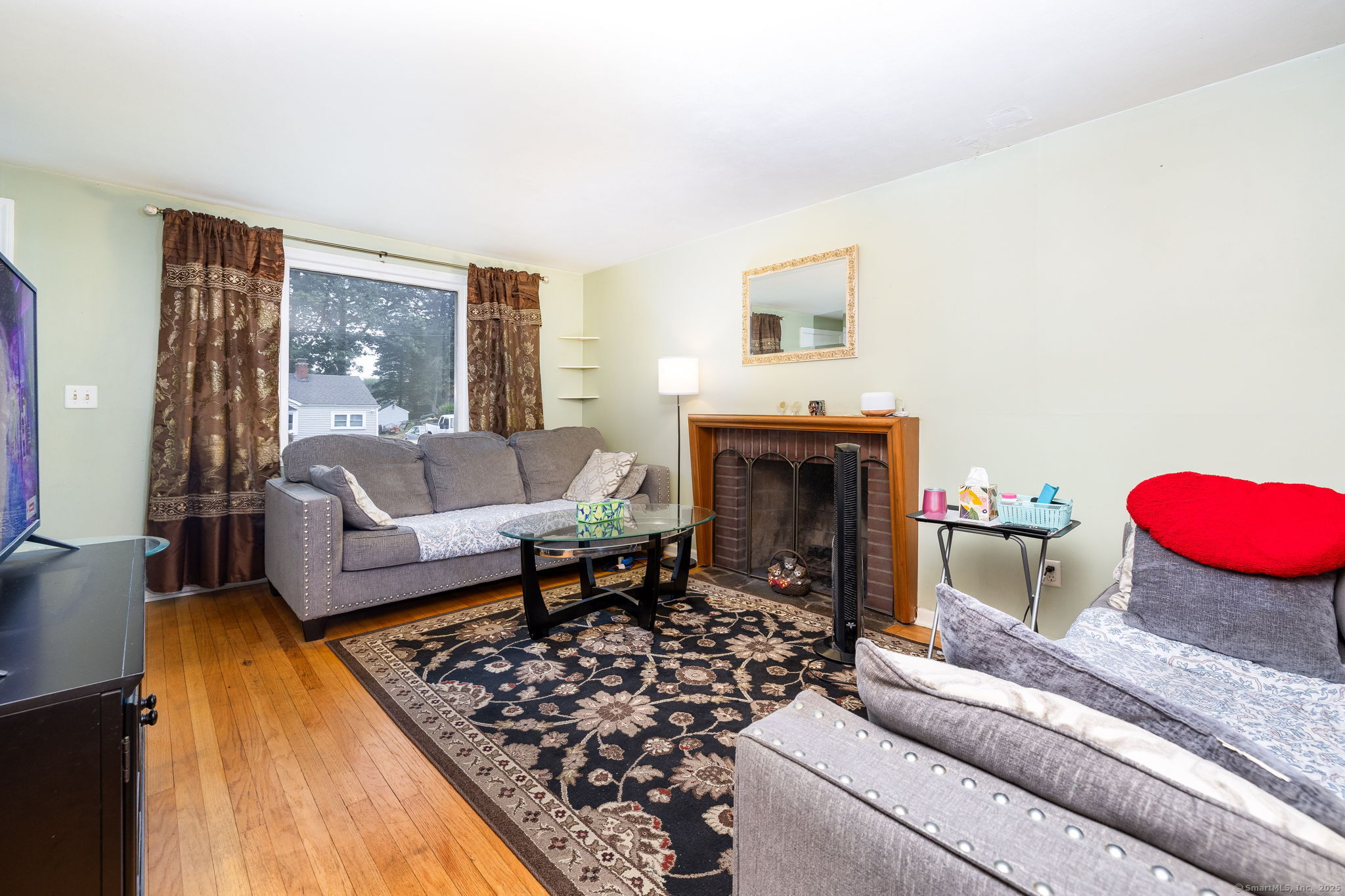 173 Timber Trail Wethersfield, CT 06109 - Photo 5 of 18 a living room with furniture and a fireplace