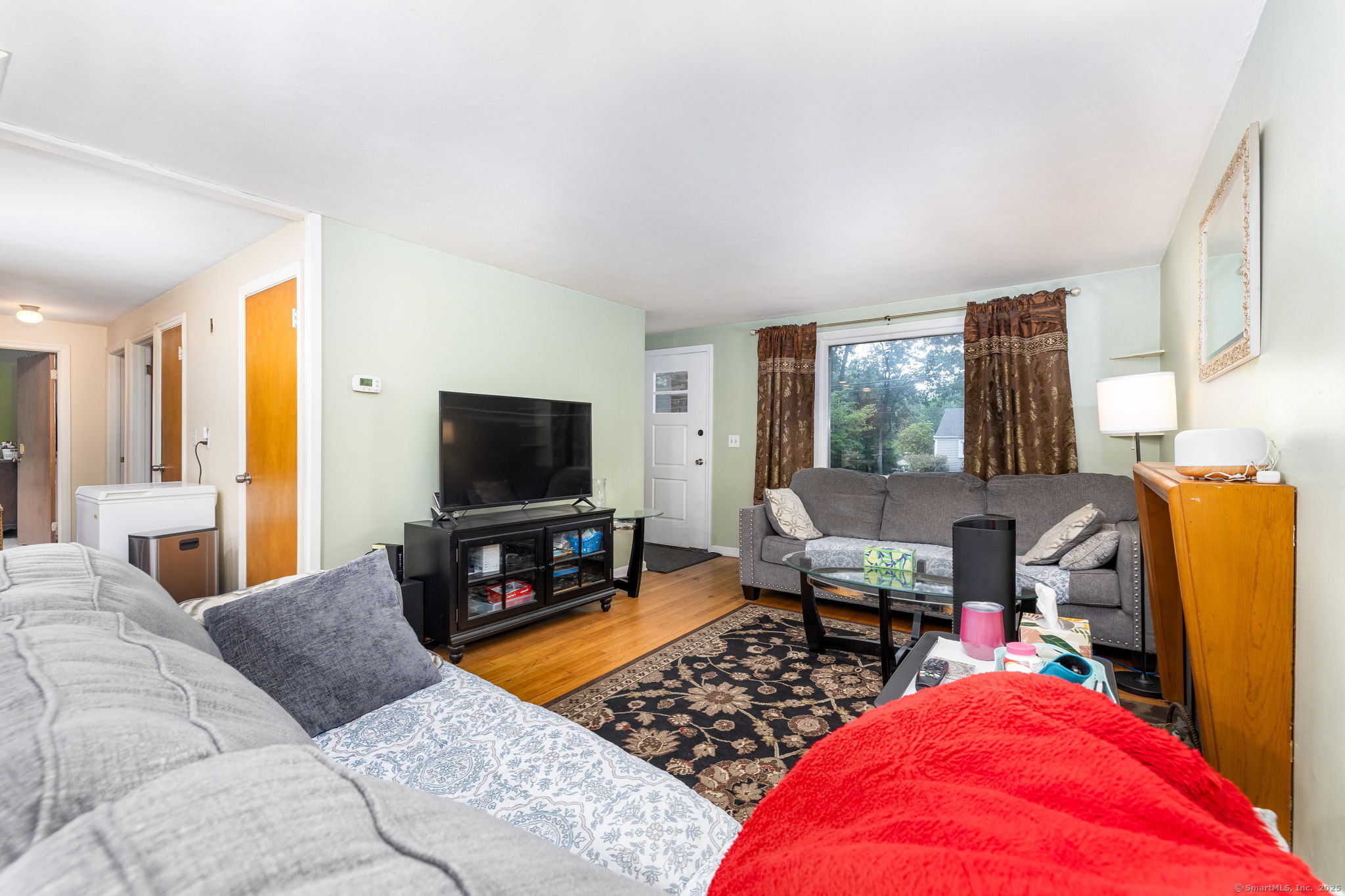 173 Timber Trail Wethersfield, CT 06109 - Photo 6 of 18 a bedroom with furniture and a flat screen tv