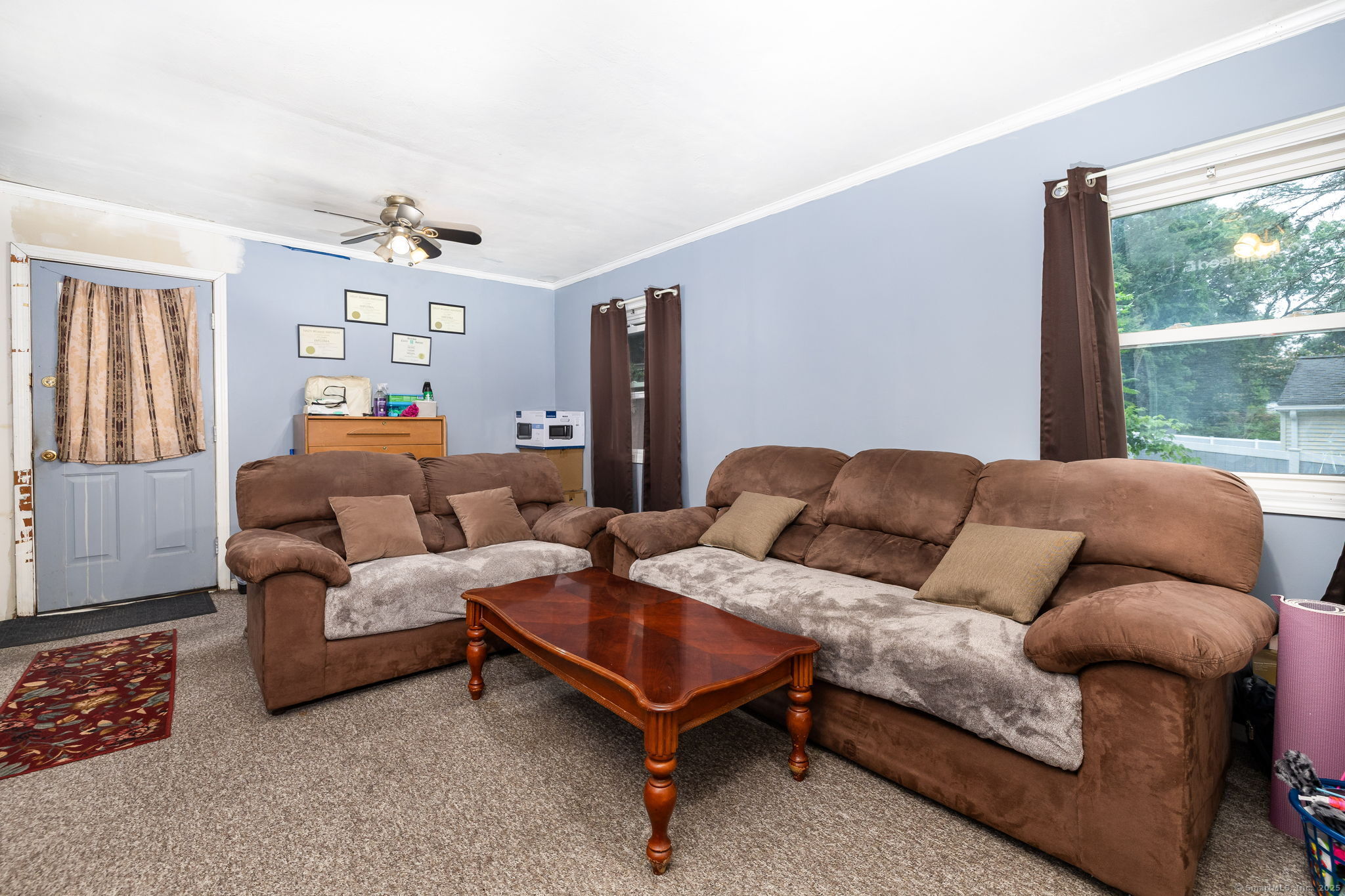 173 Timber Trail Wethersfield, CT 06109 - Photo 10 of 18 a living room with furniture and a large window