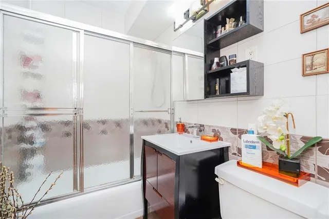 a utility room with sink dryer and washer