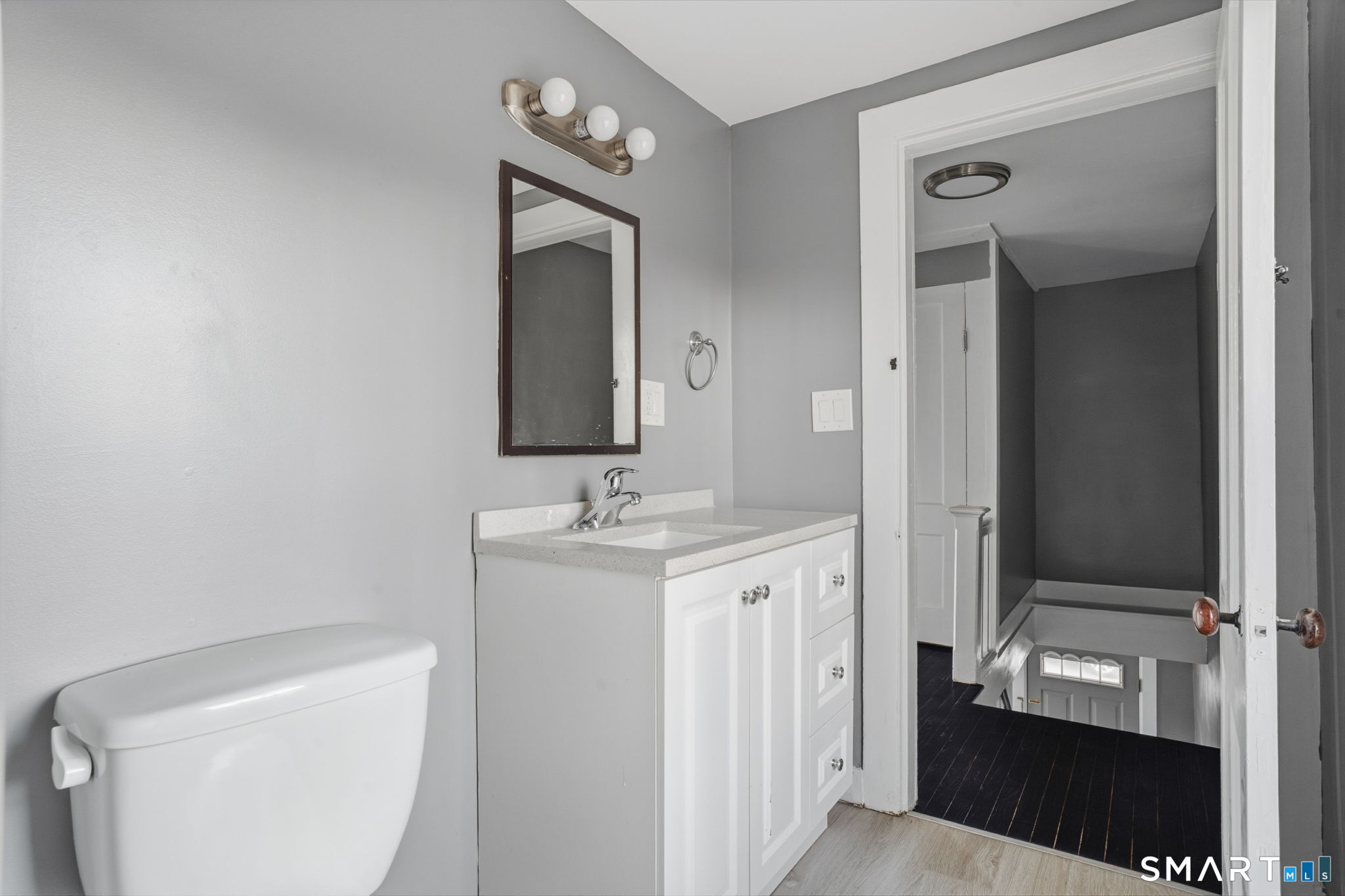 475 Mix Street Bristol, CT 06010 - Photo 27 of 36 a bathroom with a toilet sink and mirror