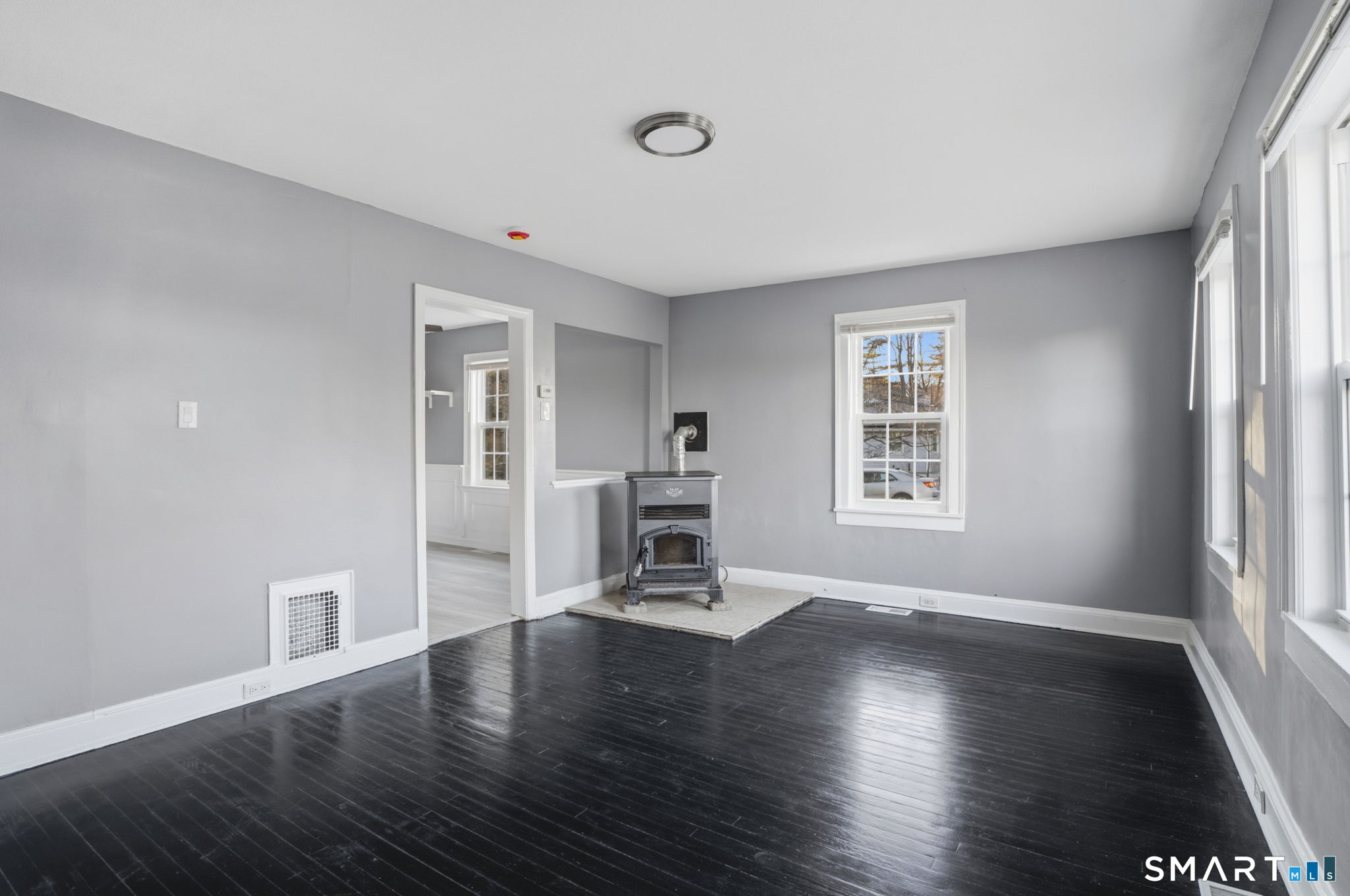 475 Mix Street Bristol, CT 06010 - Photo 8 of 36 a view of a livingroom with wooden floor and a window