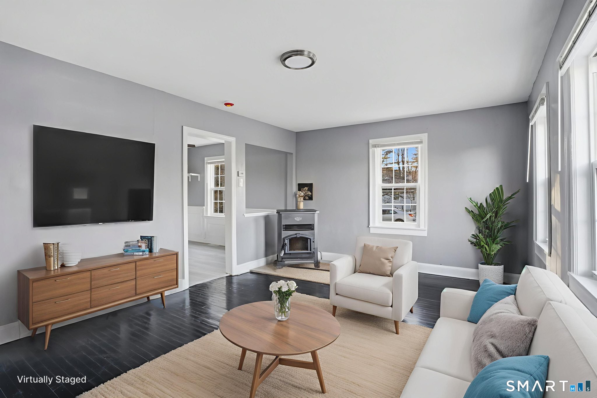 475 Mix Street Bristol, CT 06010 - Photo 9 of 36 a living room with furniture and a flat screen tv