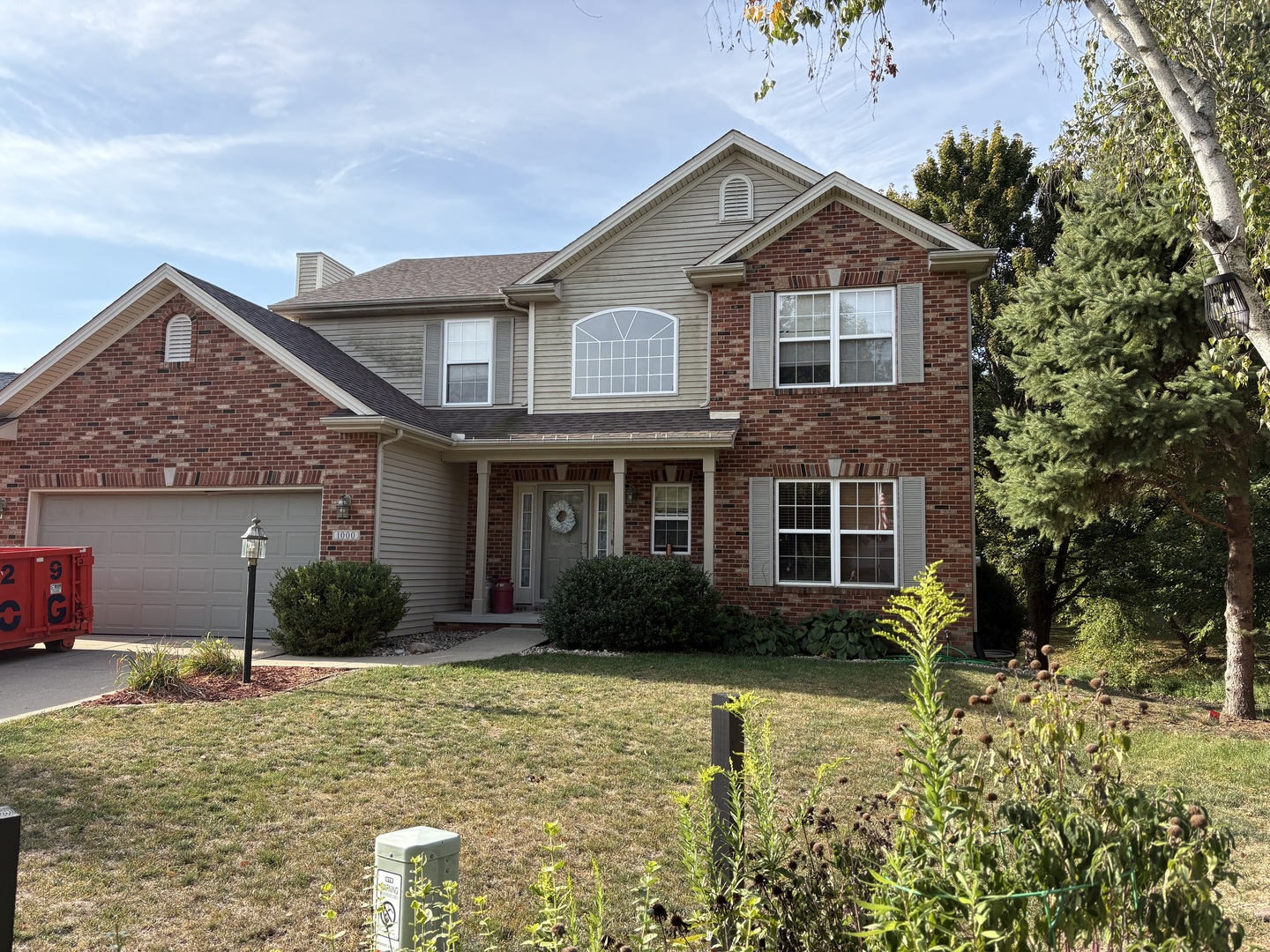 1000 Lake Pointe Lane Mahomet, IL 61853 - Photo 1 of 1 a front view of a house with garden