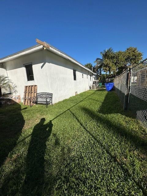 113 Northeast 75th Street, Unit FRONT Miami, FL 33138 - Photo 9 of 9 a view of a house with a yard