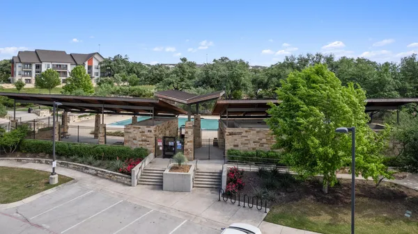 a view of a patio with a table and chairs