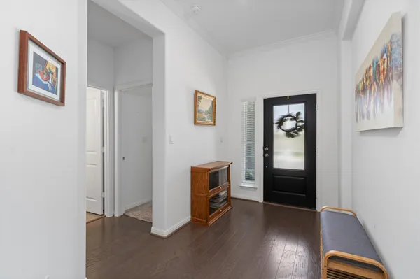 a view of a livingroom with furniture and wooden floor