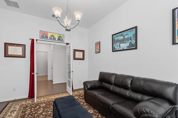 a living room with furniture and a rug