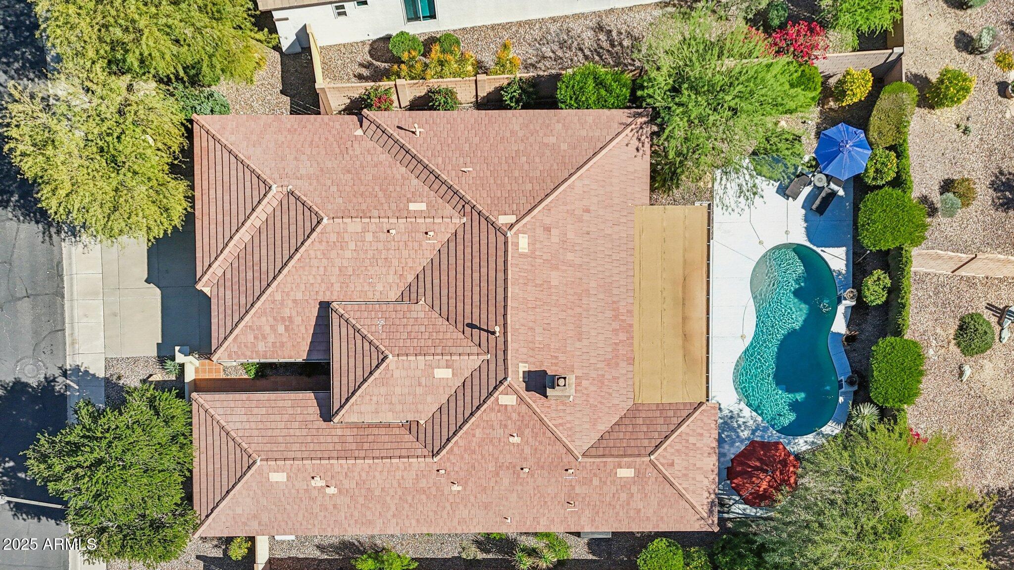 41725 North Golf Crest Road Anthem, AZ 85086 - Photo 11 of 60 an aerial view of a house with a yard and large trees