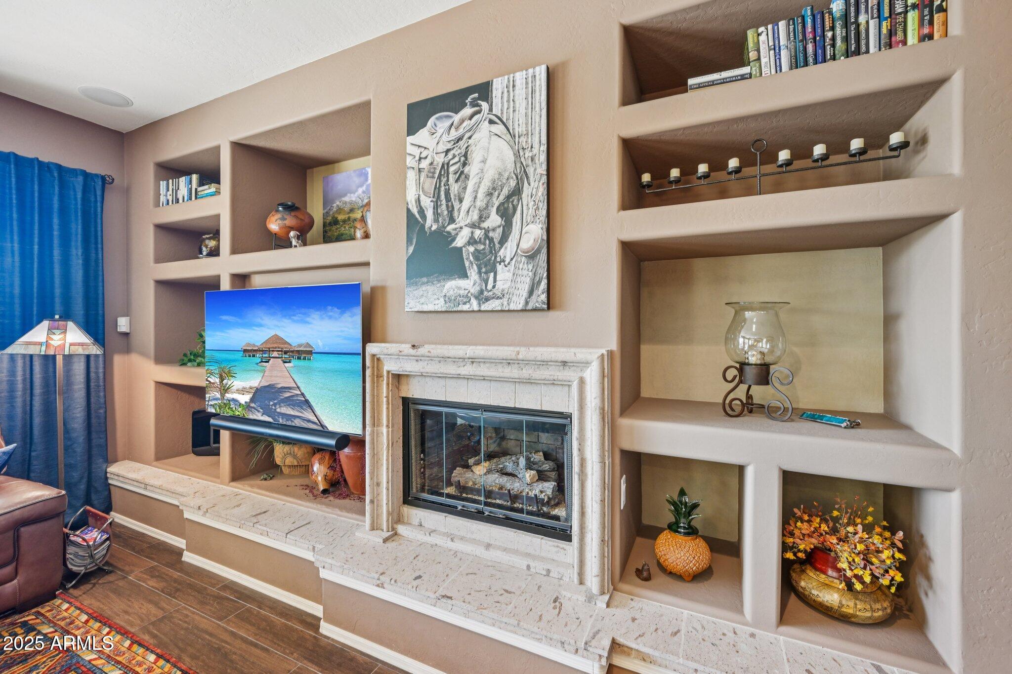 41725 North Golf Crest Road Anthem, AZ 85086 - Photo 17 of 60 a living room with furniture and a fireplace