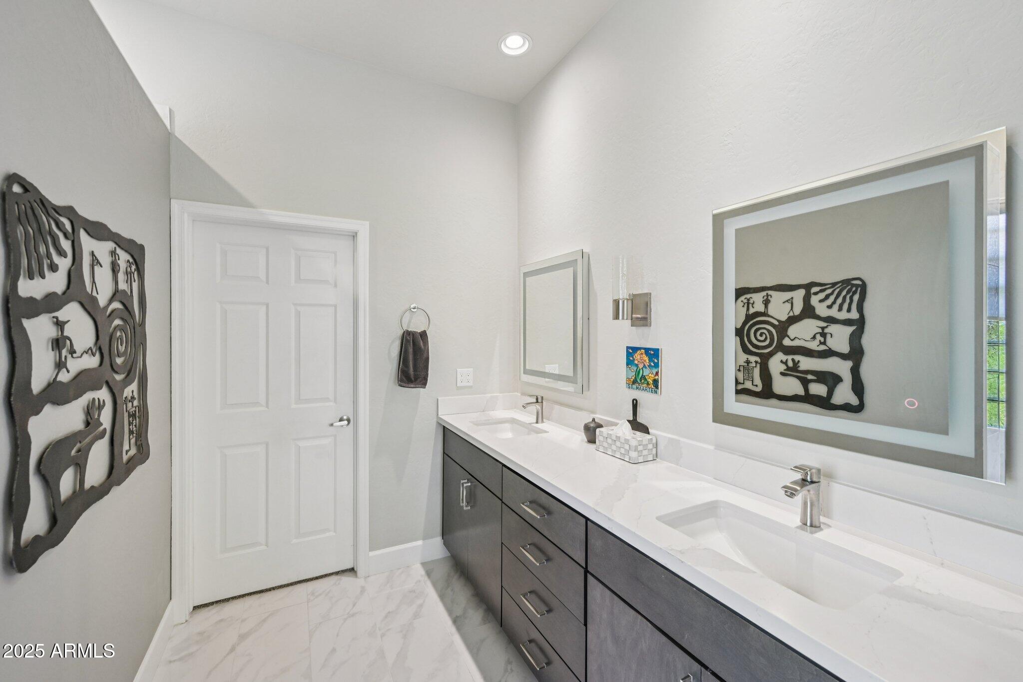 41725 North Golf Crest Road Anthem, AZ 85086 - Photo 29 of 60 a bathroom with a double vanity sink mirror and