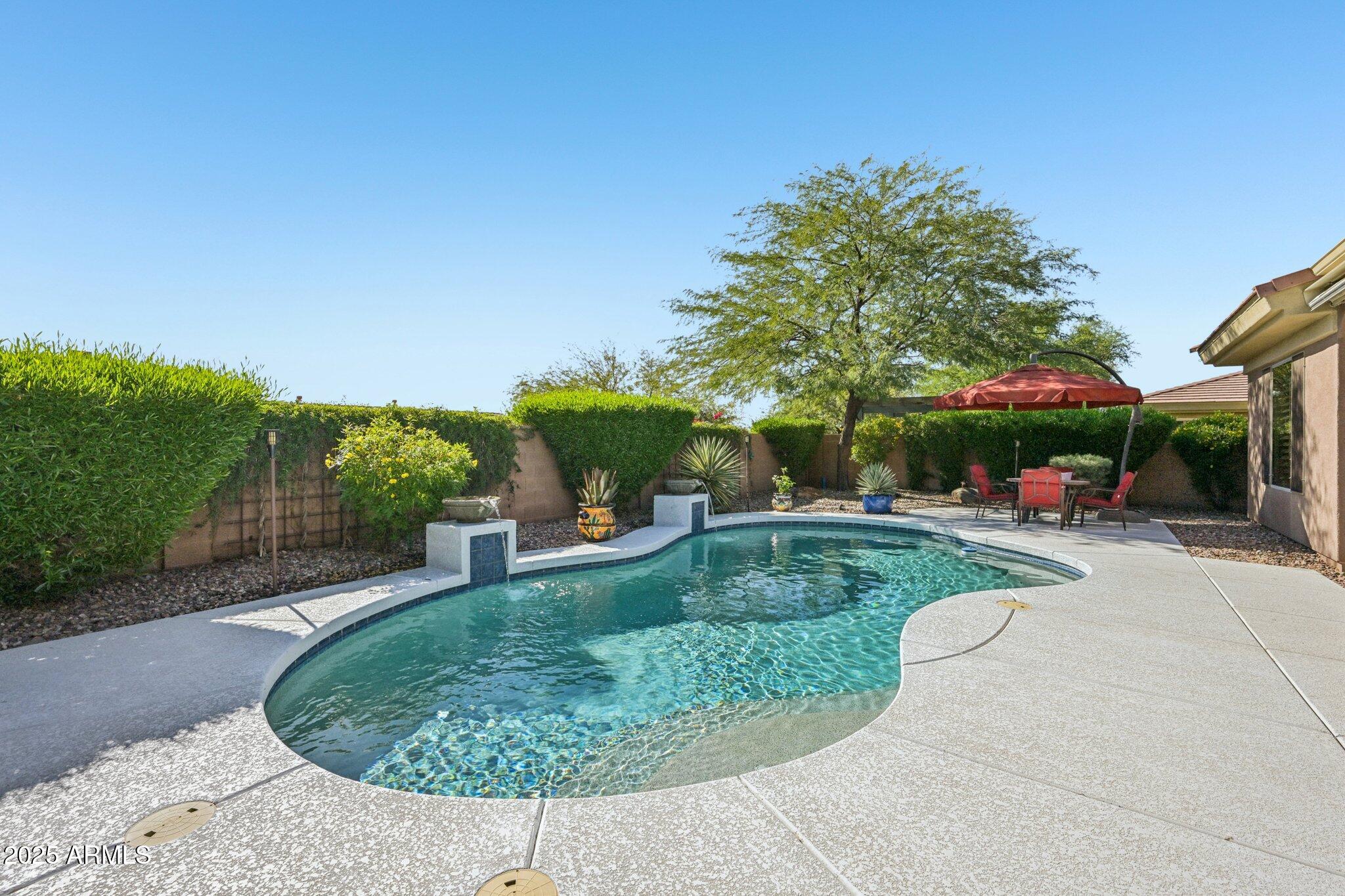 41725 North Golf Crest Road Anthem, AZ 85086 - Photo 42 of 60 a view of a backyard with sitting area