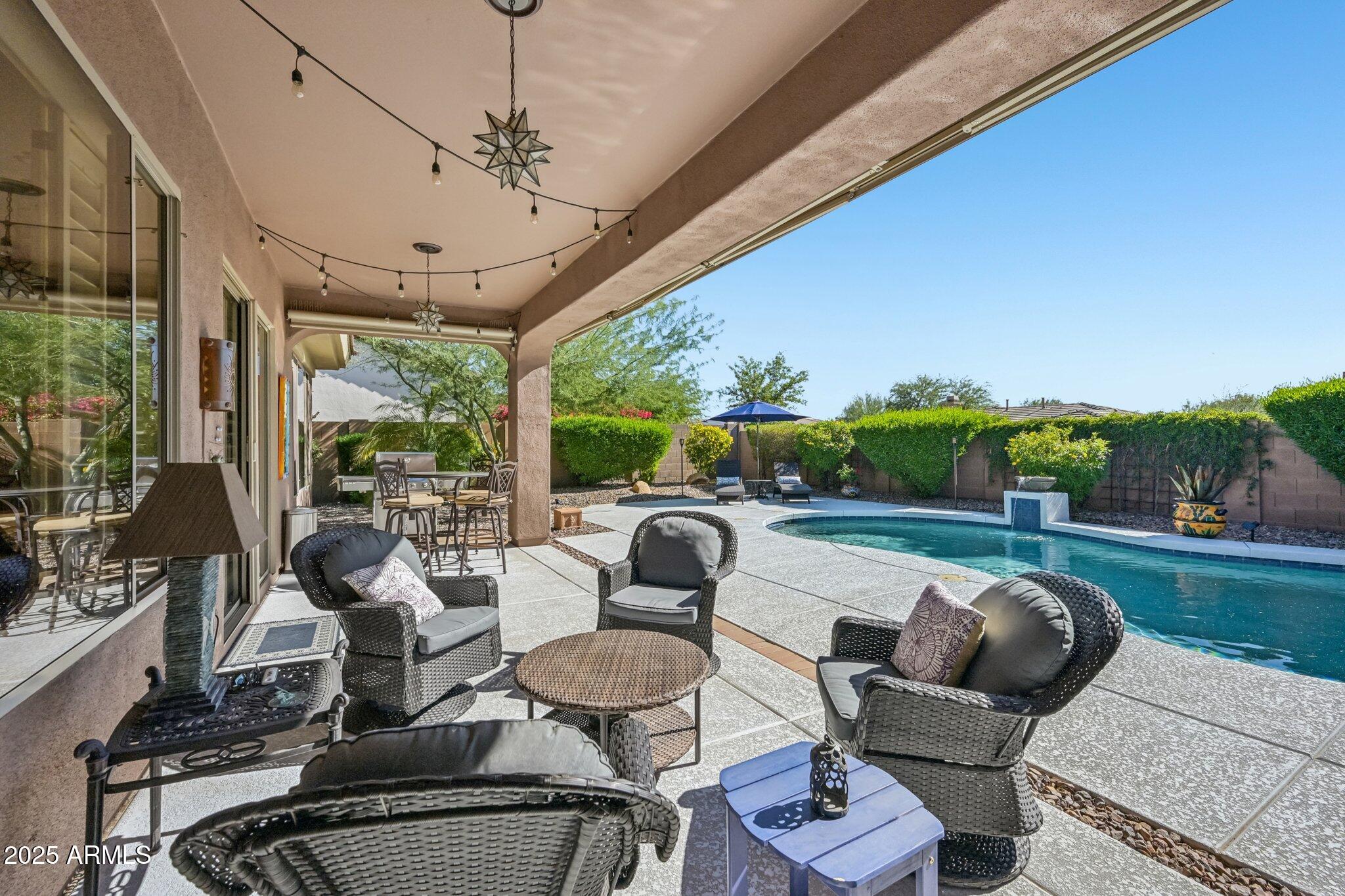 41725 North Golf Crest Road Anthem, AZ 85086 - Photo 43 of 60 a outdoor living space with furniture and garden view