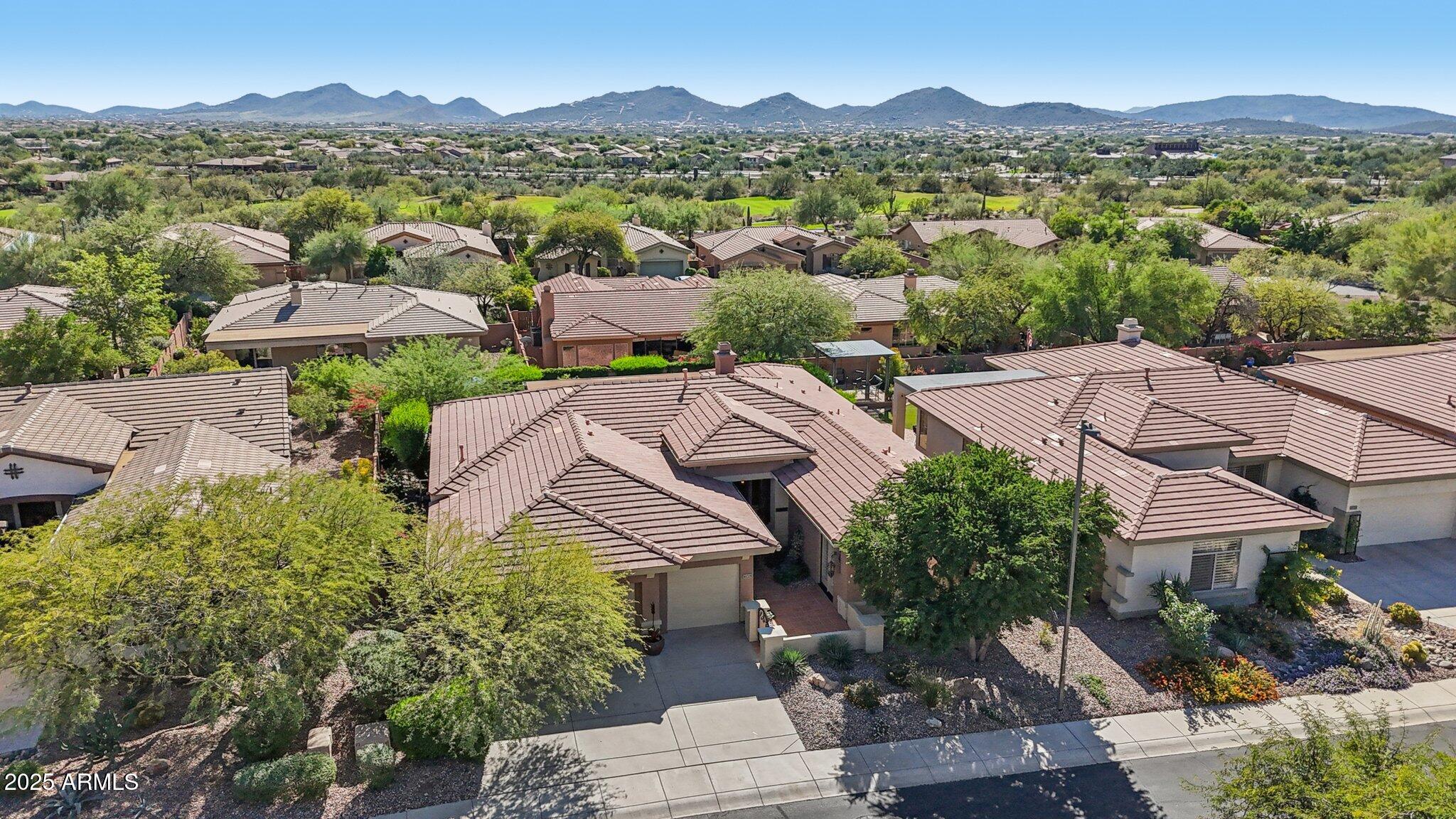 41725 North Golf Crest Road Anthem, AZ 85086 - Photo 48 of 60 an aerial view of residential houses with outdoor space