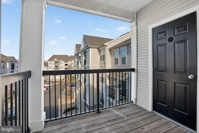 a view of a balcony with wooden floor