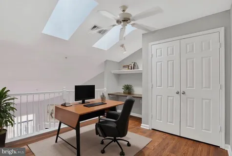 a view of a workspace with furniture