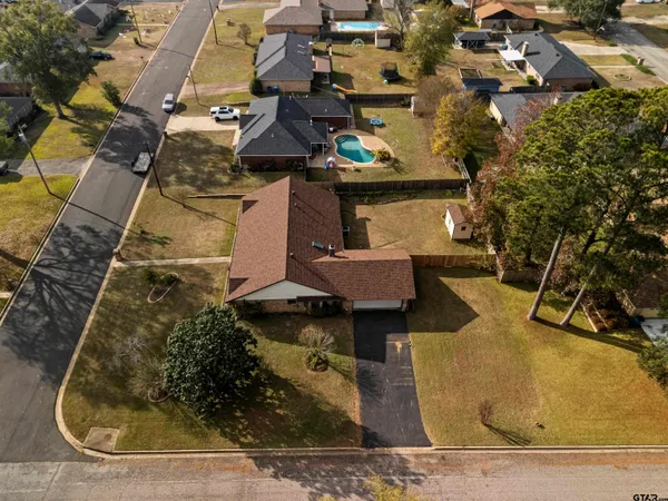 an aerial view of house with yard
