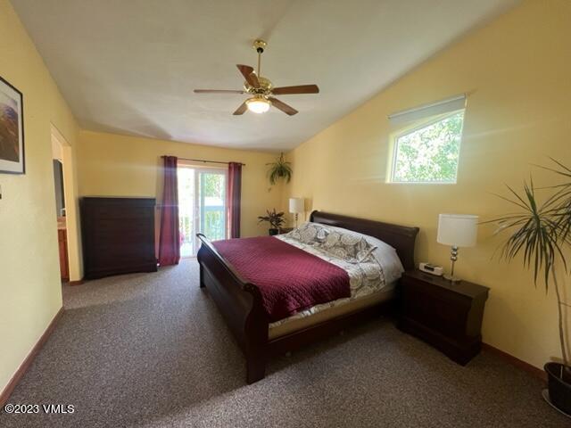 6 Ringneck Eagle, CO 81631 - Photo 28 of 50 a spacious bedroom with a bed and a chandelier